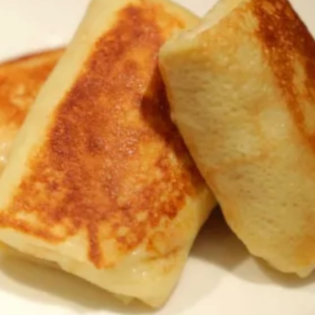 CHEESE BLINTZES WITH TWO EGGS.
